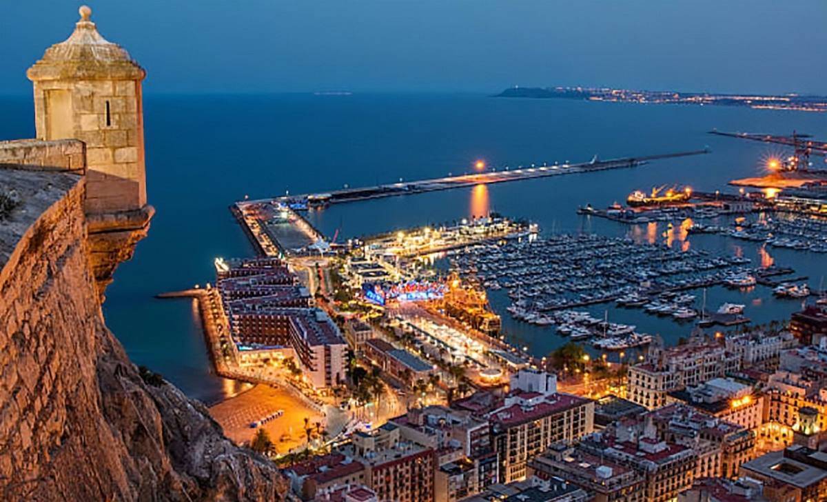 Alicante castle at night — view from Castillo de Santa Bárbara over the harbour